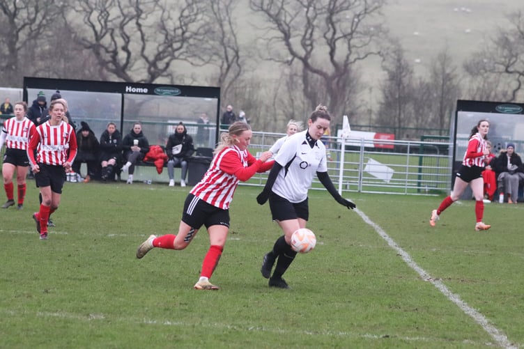 Corinthians' Ellen Gallacher (right) and Peel's Lisa Costain in action