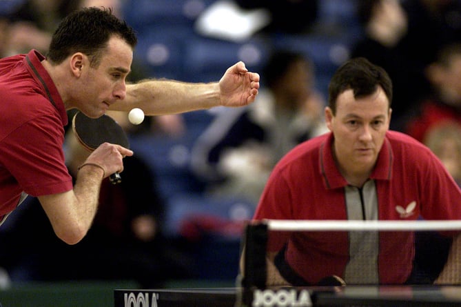 Alan Cooke (right) - seen here in action at the 2002 English National Table Tennis Championships - is one of the coaches that will be visiting the island