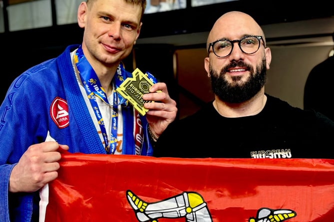 Lukasz Borciuch (left) with his IBJJF European bronze medal and head coach Conrad Roberts