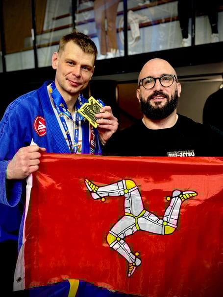 Lukasz Borciuch (left) with his IBJJF European bronze medal and head coach Conrad Roberts