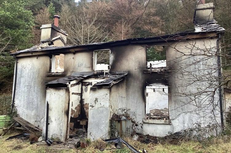 Police are investigating an arson at this building within Arrasay Plantation