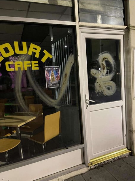 Feces smeared on the window of the Court Cafe in Douglas
