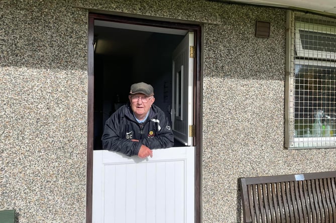 George Corkill in the hatch at Marown Memorial Playing Fields. He would serve half time drinks for players and officials and teas and coffees for spectators in Crosby, rarely missing a Marown AFC match.