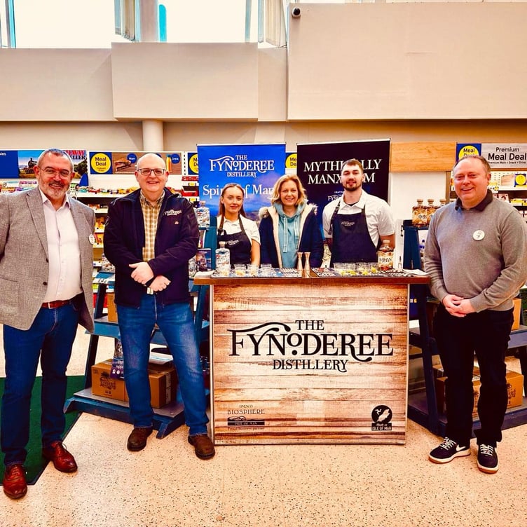 Staff from the Fynoderee Distillery with members of the Tesco team at the Lake Road store in Douglas