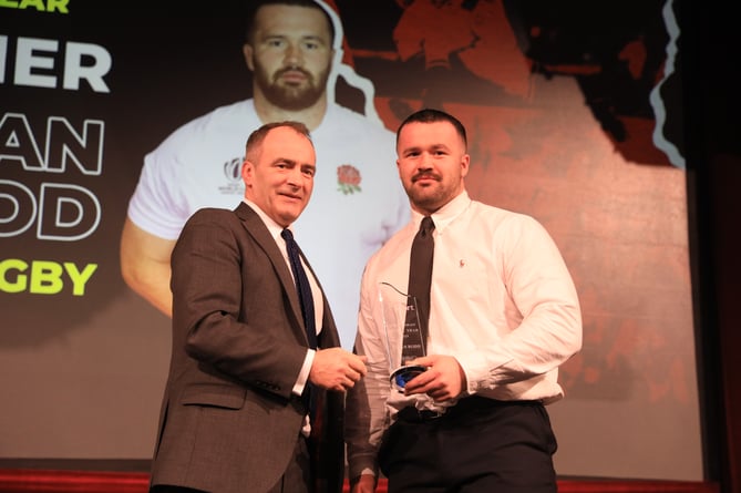 Bevan Rodd receives his Isle of Man Sportsman of the Year award from Chief Minister Alf Cannan