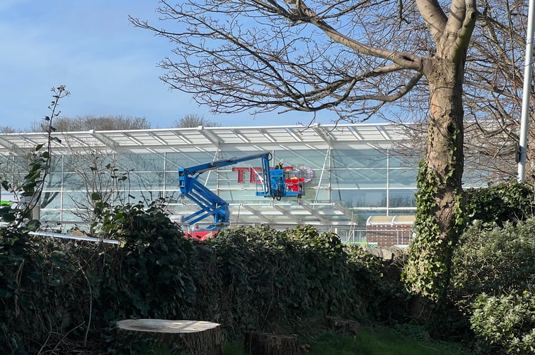 The Tesco sign is being put on to the front of the store on Victoria Road, Douglas.