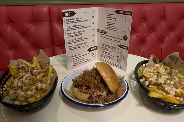 The signature dirty fries and the pulled pork sandwich at Smoky Sam's BBQ