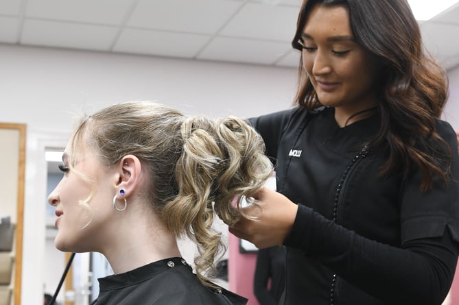The 2024 UCM Skills Test: Lucy Kenyon, first year Level 1 Hairdressing student (left), and Molly Cromwell, second year Level 2 Hairdressing student, taking part in the hairdressing challenge at the Synnova salon on the UCM campus