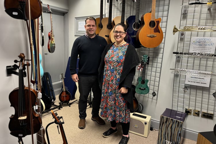 Managing director of the Auxesia Group Stuart Colligon with Heather Daykin at the Mannin Music Shop in Peel