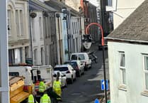 Pot hole patching underway on Isle of Man road following flower planting protest