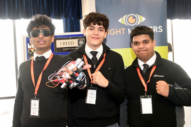 The Creed team with a smart glove, created using ultrasonic sensors and haptic feedback, designed for blind and visually impaired individuals