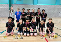 Brother and sister win under-11 badminton titles