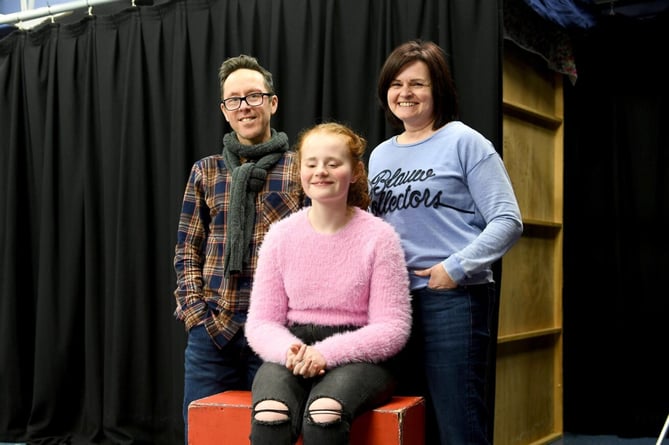 14-year-old Evie Roberts (centre), host of the Talking in the Dark podcast, with her mum Hayley Roberts (right) and Stephen Craige, head of drama and performing arts at Ballakermeen High School