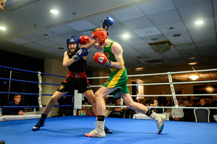 Home fighter Sonny Finch (green) recorded an impressive victory over Sidnee Ingram-Richardson and picked up the best New Horizon boxer of the night award (Photo: Steve Babb)