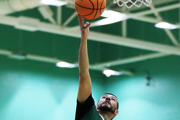 Mike Lewis goes to the basket for a lay-up. A returning Lewis helped Cavaliers in their play-off victory over the Hoops (Photo: Oliver Hamilton)