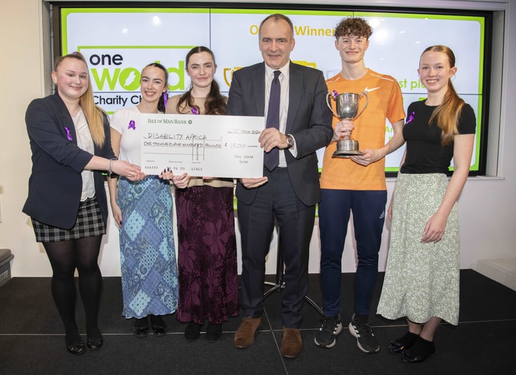 Members of the winning team from Ballakermeen are presented with their prize by Chief Minister (from left to right, Ania Majewska, Izzy Craig, Lucie Hepworth, Chief Minister Alfred Cannan, Liam Bedford, Mia Degerholm)