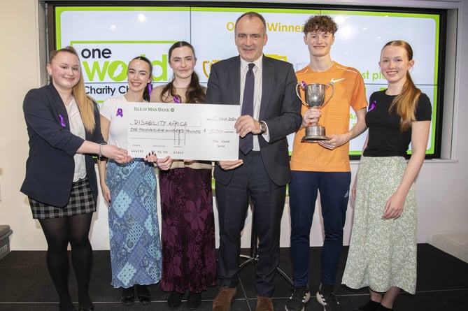 Members of the winning team from Ballakermeen are presented with their prize by Chief Minister (from left to right, Ania Majewska, Izzy Craig, Lucie Hepworth, Chief Minister Alfred Cannan, Liam Bedford, Mia Degerholm)