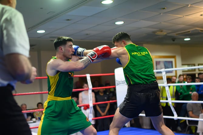 New Horizon's Matty Kinvig (left) and Mathew Griffiths (New Era) trade punches during their top-of-the-bill light-heavyweight clash at the Palace Hotel (Photo: Steve Babb)