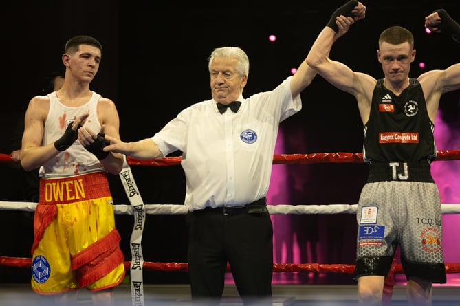 TJ Phair's arm is raised to confirm the Manx ABC's victory over Owen Aspell who was stopped by the doctor following a cut above his eye (Photo: 3 Legs Photography/Joe Ricciardi)