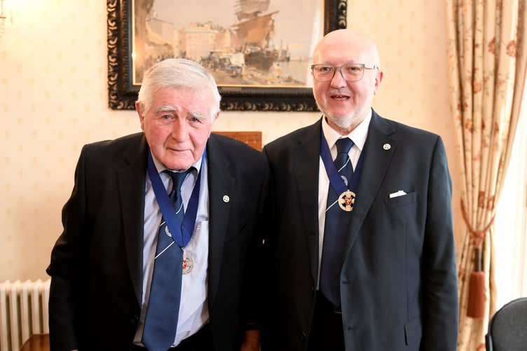 The swearing in of Dave Martin (centre) as Captain of the Parish of Andreas at Government House - pictured with John Cannell