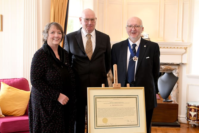 The swearing in of Dave Martin as Captain of the Parish of Andreas at Government House - pictured with Joanne Sayle and Chris Sayle, children of the late Dorothy Sayle, the previous Captain of Andreas parish