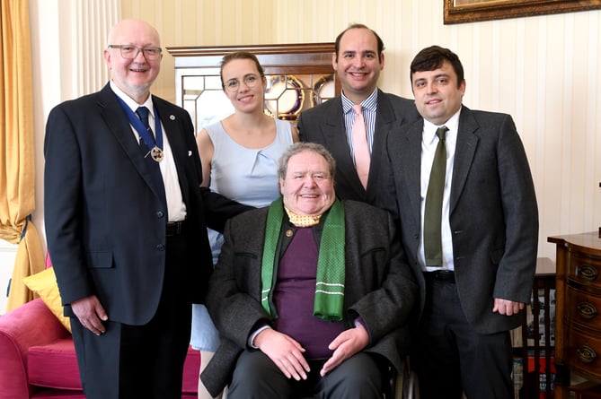 The swearing in of Dave Martin as Captain of the Parish of Andreas at Government House - pictured with the Chapman family, including Dave's godson and goddaughter