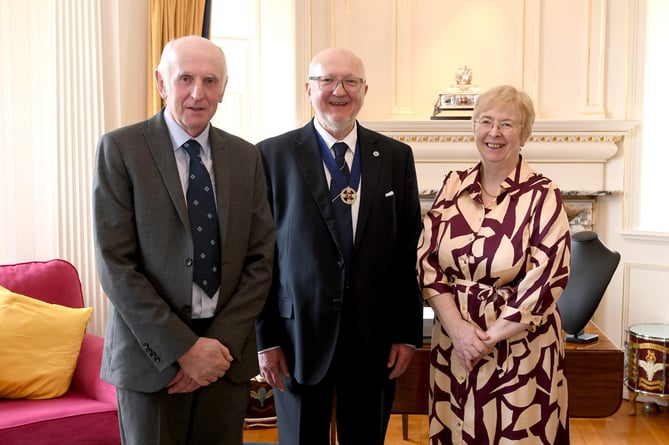 The swearing in of Dave Martin as Captain of the Parish of Andreas at Government House - pictured with cousins Alan Martin and Annie Martin