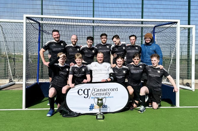 Vikings players celebrate with the Men's Premiership hockey trophy after ending a 35-year wait for the league title with victory over Castletown on Saturday afternoon