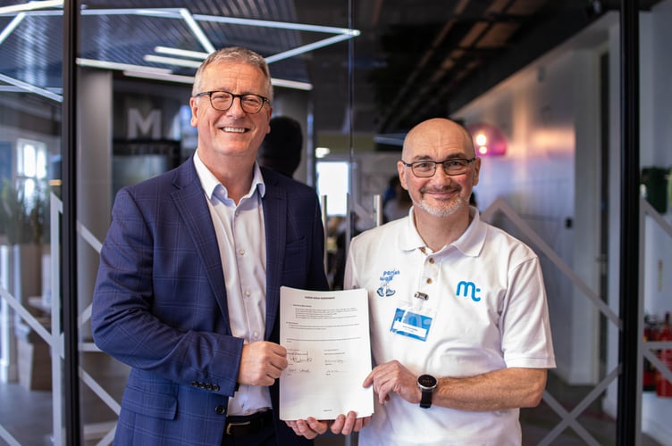 Chief executive of the Manx Telecom Group Gary Lamb (left) with the Parish Walk's Kevin Walmsley