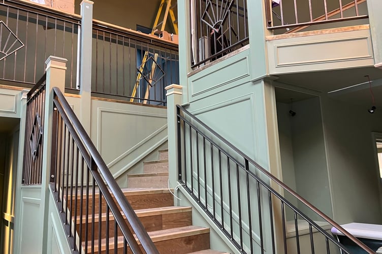 The staircase leading up to the upstairs restaurant and private dining room