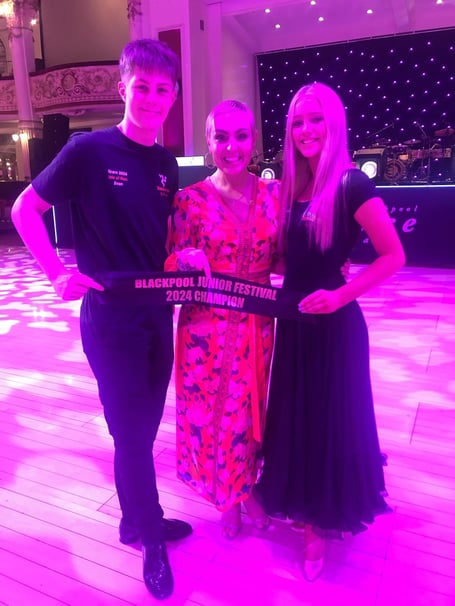 Onchan dance champions Evan O'Dea and Lula-Belle Findlay with Strictly Come Dancing star Amy Dowden (centre)