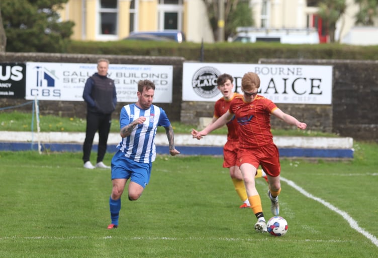 Ramsey's Mark Slinger and Marown Ethan Ready (right)