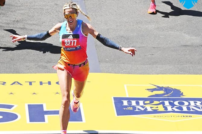 Christa Cain celebrates as she crosses the finish line in the Boston Marathon in a time of two hours 46 minutes 53 seconds. That is unofficially the fifth fastest marathon time by an Isle of Man woman to date