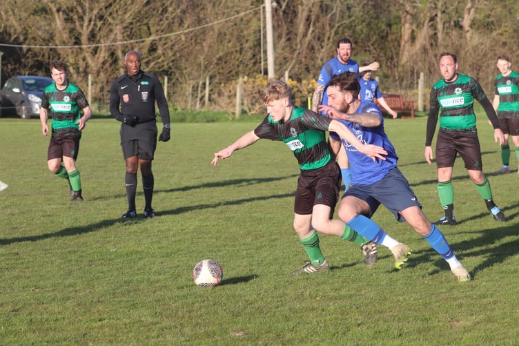 Michael United's Dean Francis (left) and DHSOB's Arran Larressey tussle for possession during Wednesday evening's DPS Ltd Combination Two clash which ended in a 2-2 draw (Photo: Paul Hatton)