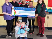 Cafe Lingo makes donation to Rebecca House