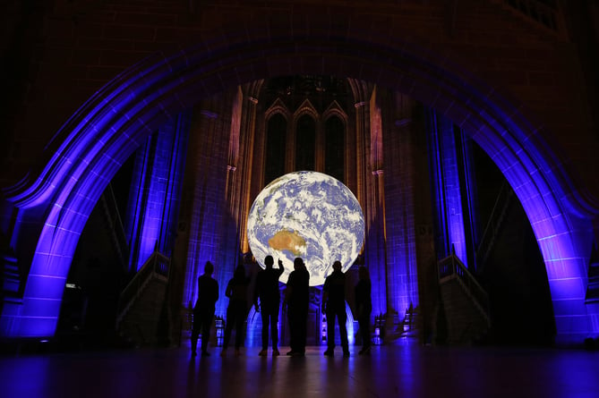 Gaia viewed at Liverpool Cathedral.

Located in Britain;s largest cathedral, the artwork called Gaia, hangs majestically in the Grade I listed building and features accurate and detailed NASA imagery of the earth.