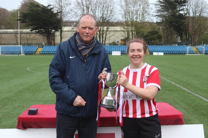 Isle of Man FA chief operating officer Kevan Maitland presents the FA Cup to Peel captain Becky Corkish (Photo: Paul Hatton)