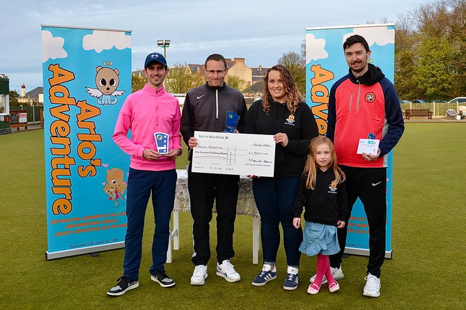 Sarah Owen from Arlo’s Adventure (and her daughter Ava) accept a cheque for £1,500 from Chas Grills Memorial winners (left to right) Jordan Cain, Glynn Hargraves and Matt Quirk (Photo: Arnie Withers) 