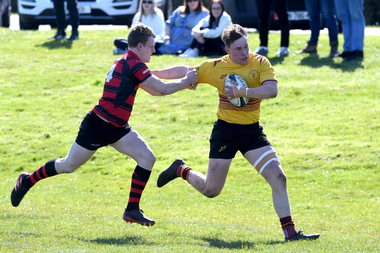 Douglas’ Sam McCord fends off Ramsey’s Brandon Atchison during last weekend's dress rehearsal for this Saturday's Manx Cup final (Photo: Dave Kneale)