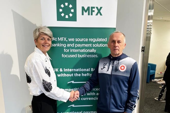 England walking footballer Steve Falconer pictured with MFX managing director May Hooper after receiving sponsorship from the company