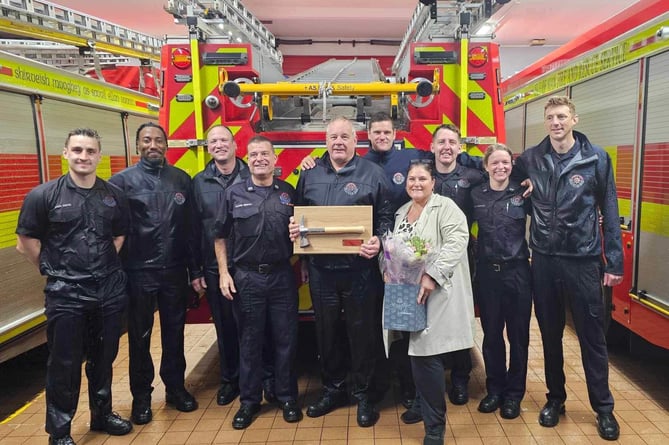 Douglas firefighter Floyd Askin (centre) retired this week after 23 years service 