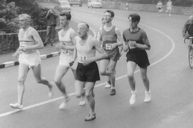 A group of runners in the early stages of the 1964 TT 40-miler, with the great Bill Kelly (far left), clearly well into his fifties, Peter McElroy, Joe O’Hanlon (dark vest and spectacles), and former president of Tynwald Noel Cringle (far right). The runner nearest camera in the black shorts and light top is likely a visiting athlete 