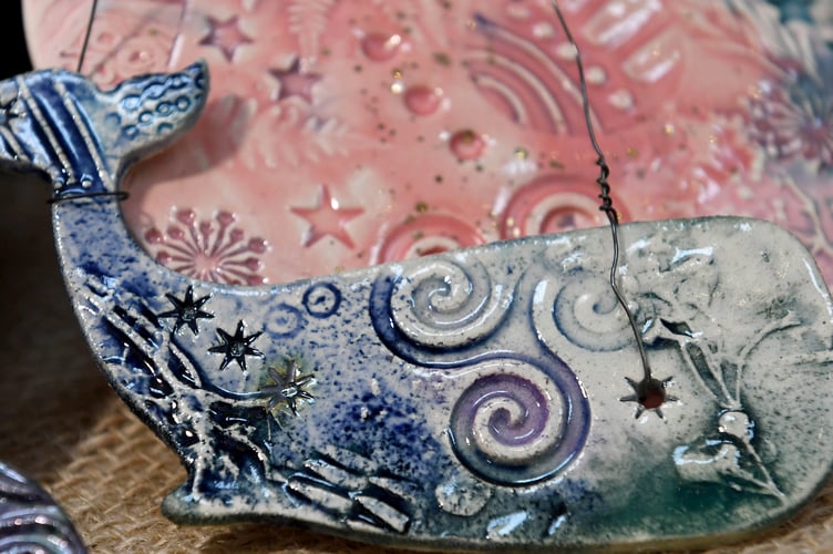 A ceramic whale on sale at the Aos-si stall