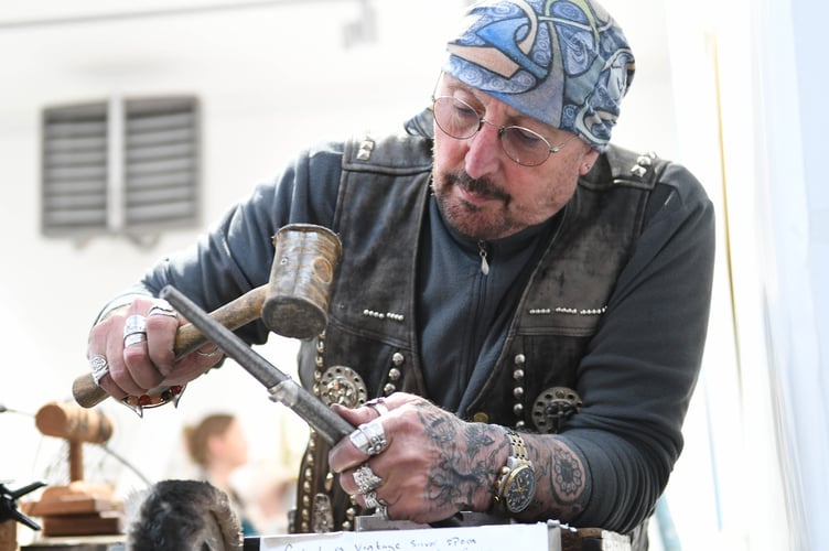 Kim Maurer, better known as Harley Kim, makes handmade rings from silver spoons at the Finders Keepers artisan market at Artreach Studios in Peel