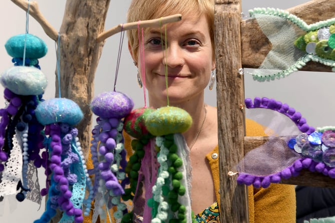 Rachel Roberts with felt jellyfish on display at her Mhara from the Sea stall