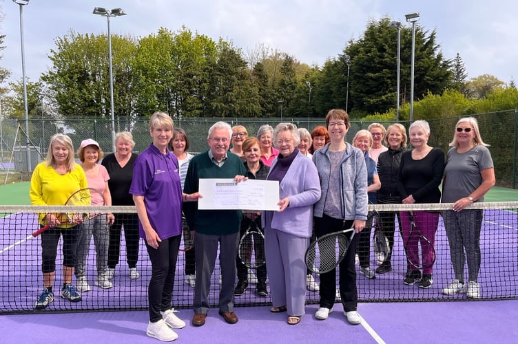 Albany LTC’s Friday Morning Ladies group hand over a cheque for £400 to club president Bryan and Pat Sharp as a donation to the indoor court roof fund