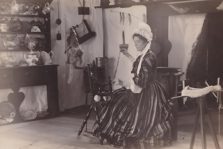 Sophia Morrison at a Spinning Wheel on stage in the Albert Hall, Peel in 1909.