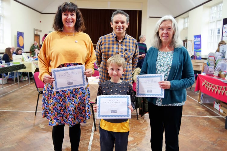 The winners of the 2021 prize with Jo Callister (left), Orry Franklin (front), and Sandra Caley. Behind them is Adrian Cain, who was Chairman of Pobble at that time