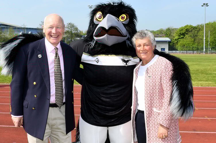Manx Youth Games mascot Odin the Raven with Lieutenant Governor John Lorimer and Lady Lorimer