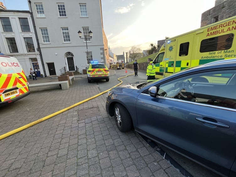 Fire crews set up hoses outside the restaurant late on Sunday evening